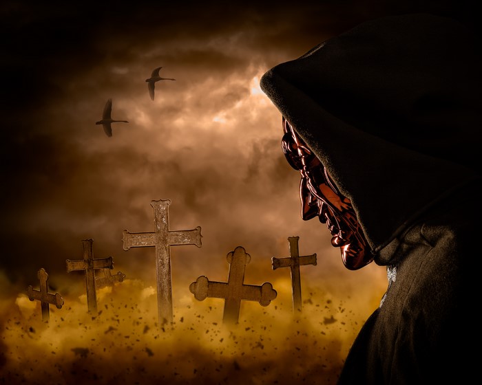 Demon in a Hooded Robe in a Graveyard