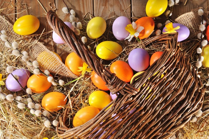 Easter eggs in a wicker basket with pussy willows