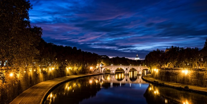 Ponte Sant'Angelo bridge over Tiber River at night in Rome