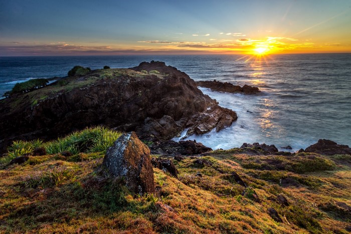 Sunrise over rocky coast at Hat Head National Park, Australia