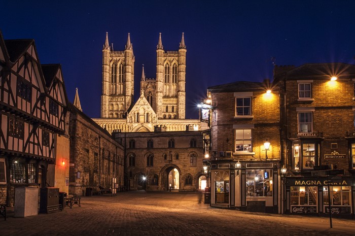 Lincoln Cathedral and historic buildings at night