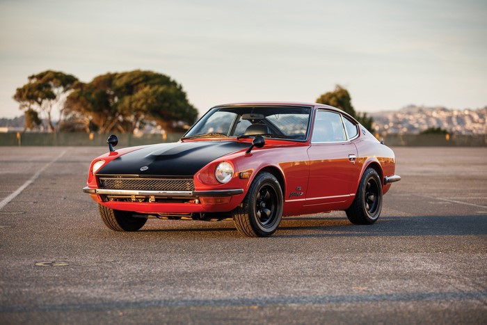 Red 1969-73 Nissan Fairlady Z432 with black hood