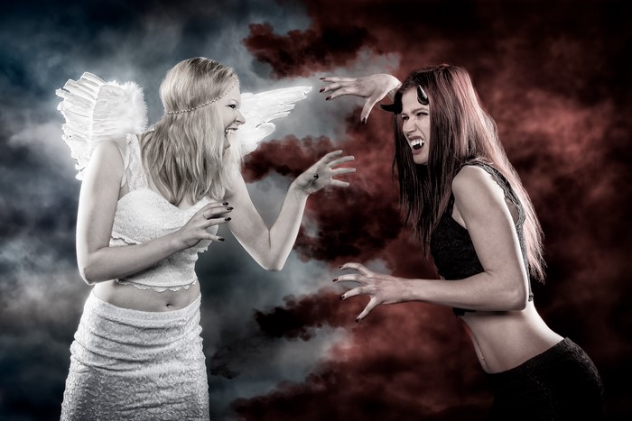 Angel and Demon women facing each other