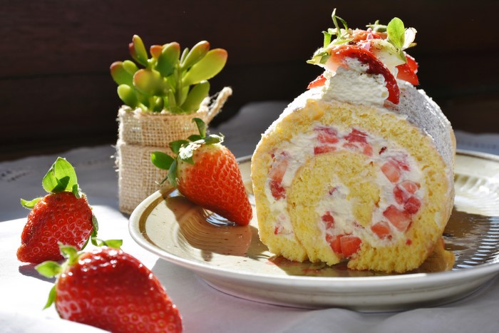 Strawberry Swiss Roll Cake with Strawberries and Succulent Plant