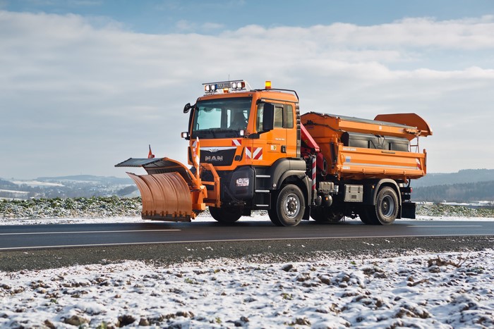 MAN SE Truck with Snow Plow and Salt Spreader