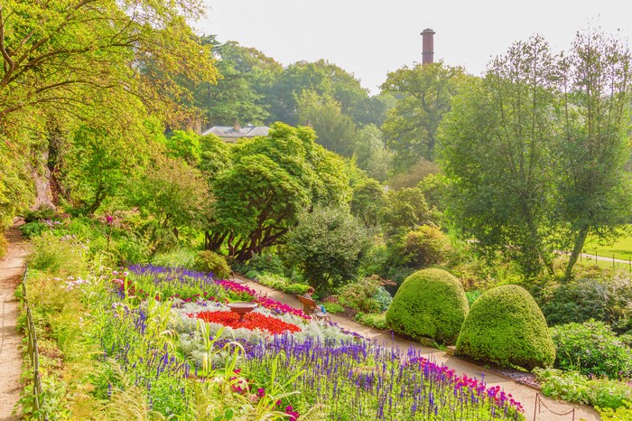 Beautiful park with flower beds and trees in Cheshire East, England