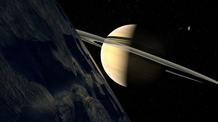 Saturn and its rings with a rocky moon