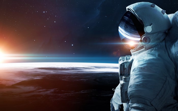 Astronaut in space above planet surface