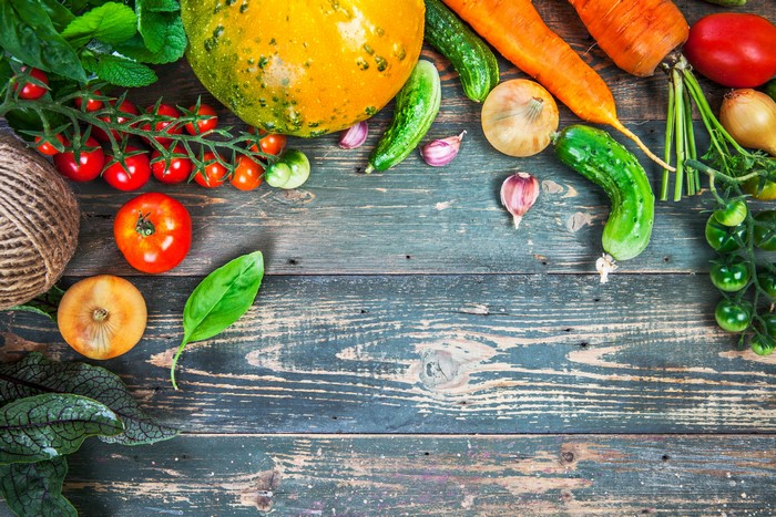Vegetables and twine on a wooden table