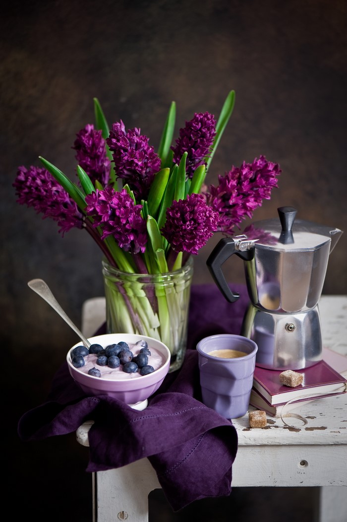 Still life with hyacinths, blueberries, and coffee