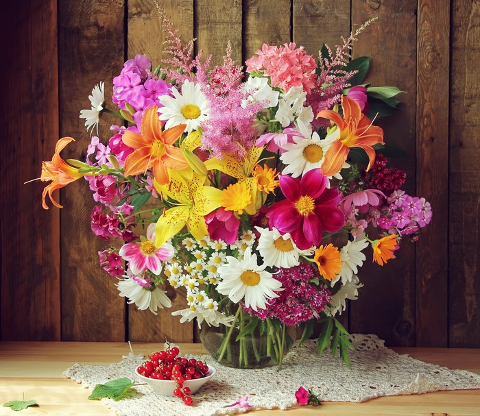Bouquet of colorful flowers with red currants