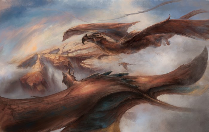 Dragons flying over rocky cliffs at sunrise