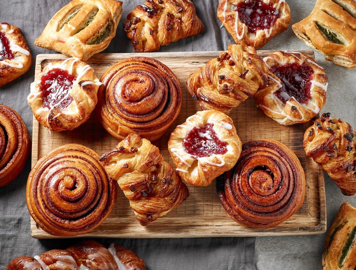 Assortment of Pastries and Buns on a Cutting Board