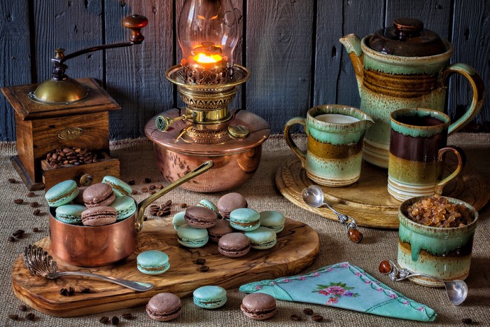 Still-life with coffee mill, macarons, and kerosene lamp