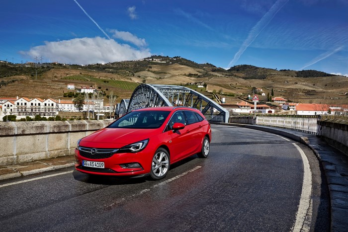 Red Opel Astra Sports Tourer on a bridge