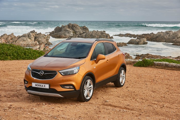 Orange Opel Mokka X by the Ocean