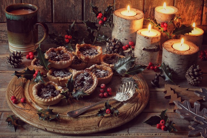 Christmas tarts with candles and mug