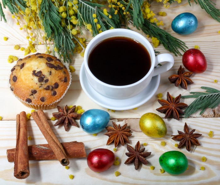 Easter coffee with muffin, cinnamon, star anise, and eggs