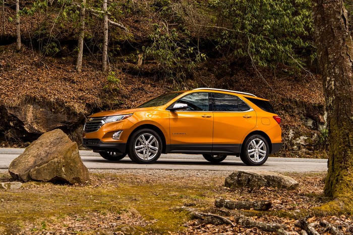 Orange 2018 Chevrolet Equinox parked on a road