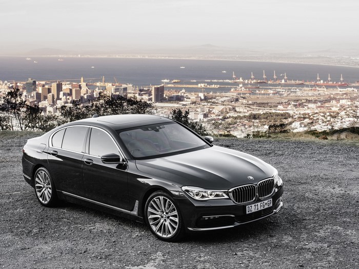Black BMW 7-Series Sedan with Cityscape Background