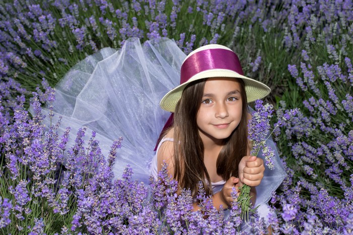 Girl in a hat in a lavender field