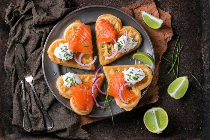 Heart-shaped waffles with smoked salmon and cream cheese