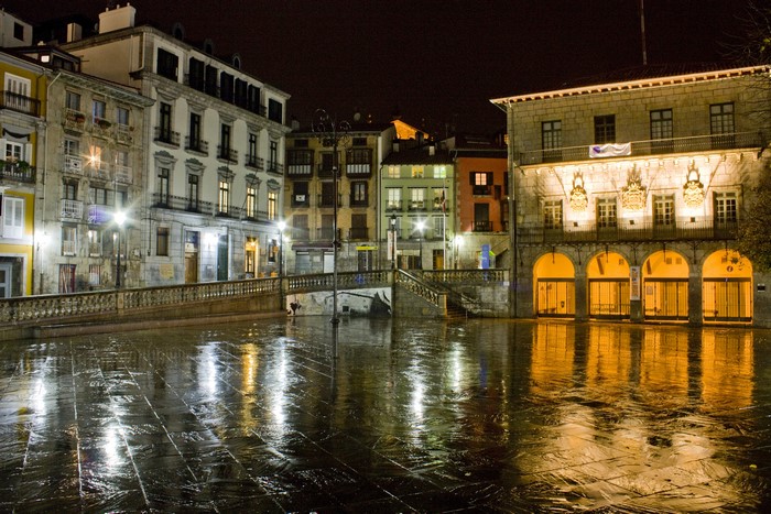 Night view of Lekeitio Basque Country, Spain with wet streets