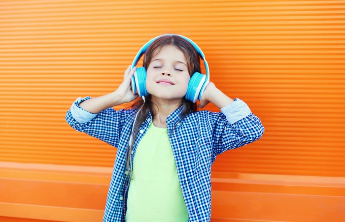 Girl with headphones listening to music