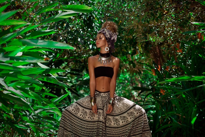 Woman in tribal attire in a jungle
