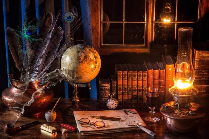Still life with kerosene lamp, globe, books, and peacock feathers