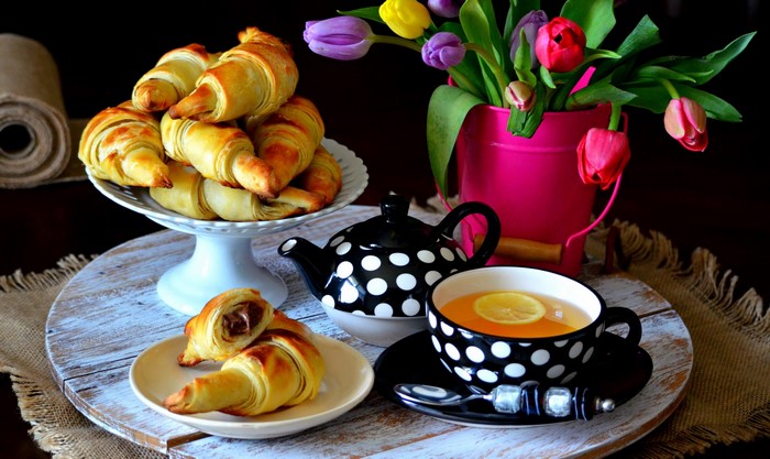 Croissants and tea with tulips
