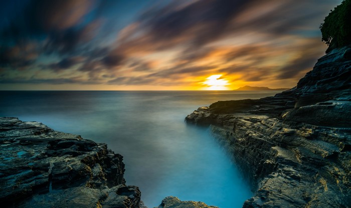Sunset over the ocean coast in Hawaii