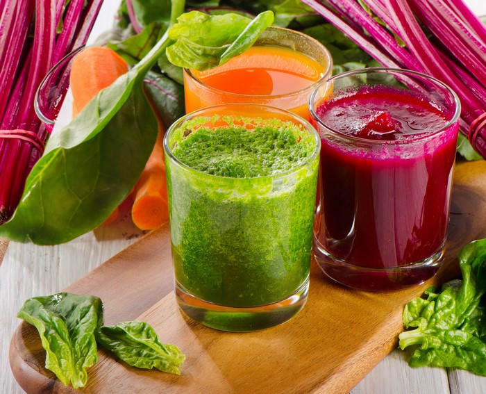 Three glasses of fresh vegetable juices and smoothies