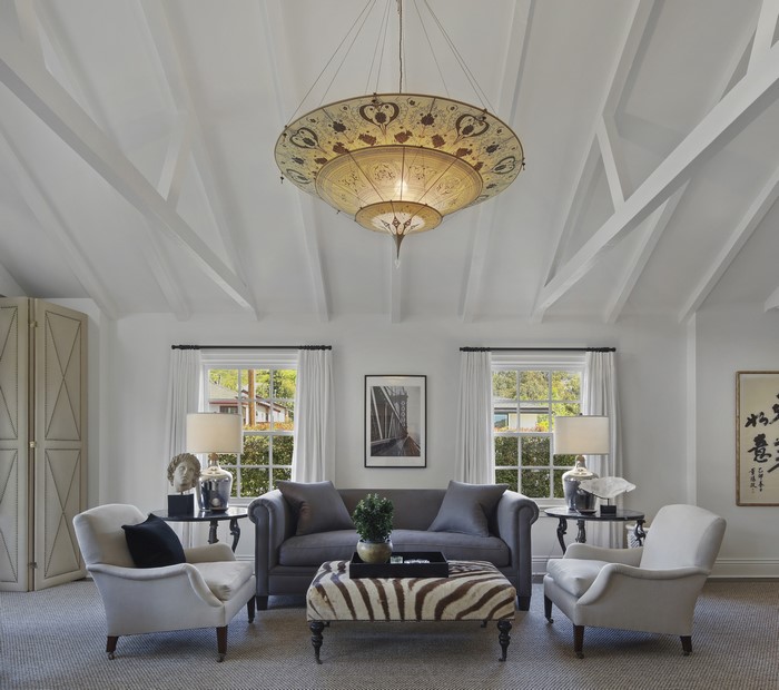 Living room with chandelier, sofa, and armchairs