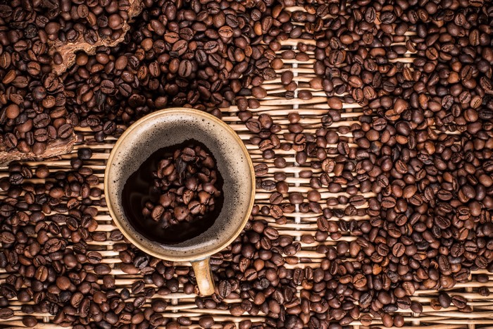 Coffee beans and a cup of coffee