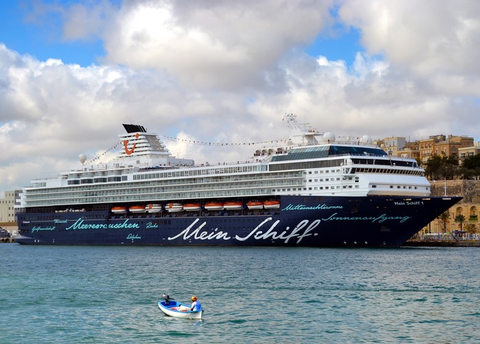 Mein Schiff 1 cruise liner in a harbor