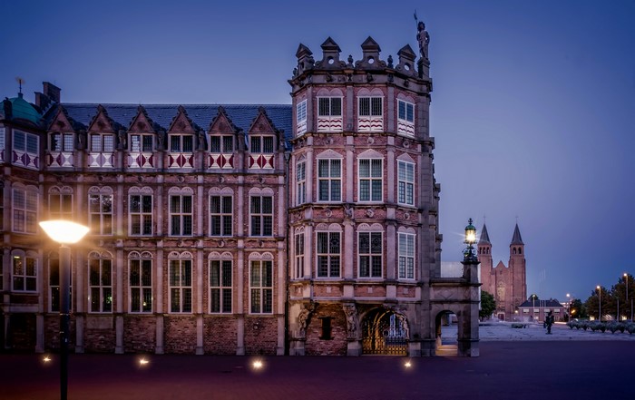 Grote Kerk and historic building in Arnhem, Netherlands at dusk