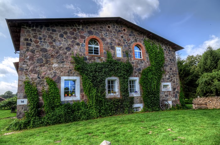 Stone house with ivy in Klein Zastrow, Germany