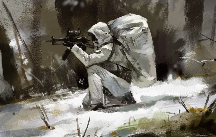 Soldier in white camouflage with assault rifle in snowy forest