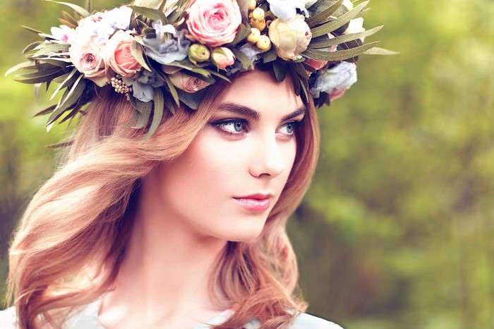 Woman with flower wreath looking to the side