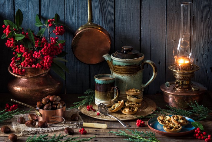 Still-life with nuts, berries, and a kerosene lamp