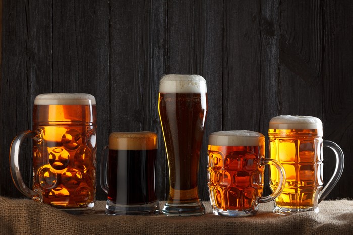 Five glasses of beer on a table