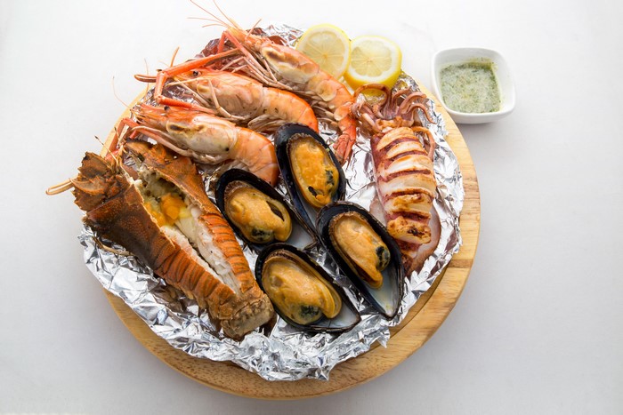 Seafood platter with shrimp, lobster, mussels, and squid