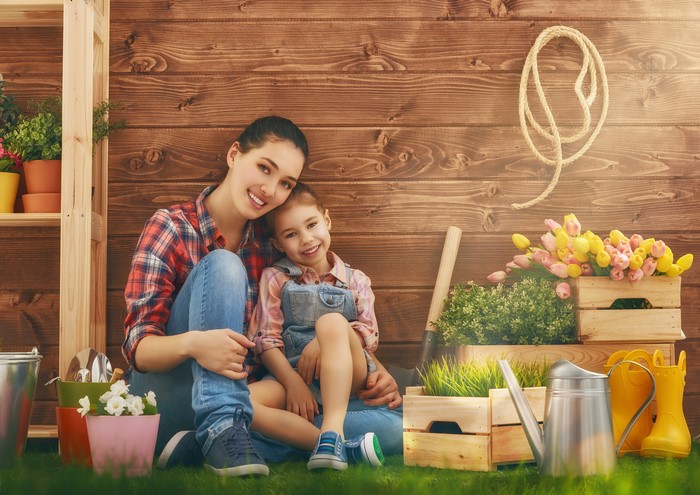 Mother and daughter gardening with tulips