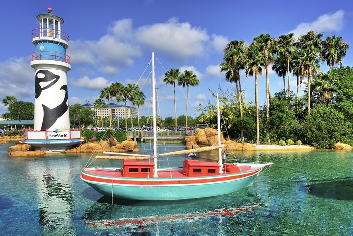SeaWorld Orlando lighthouse and boat with palm trees