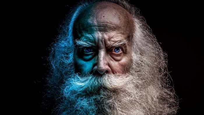 Old man with a long white beard and blue eyes