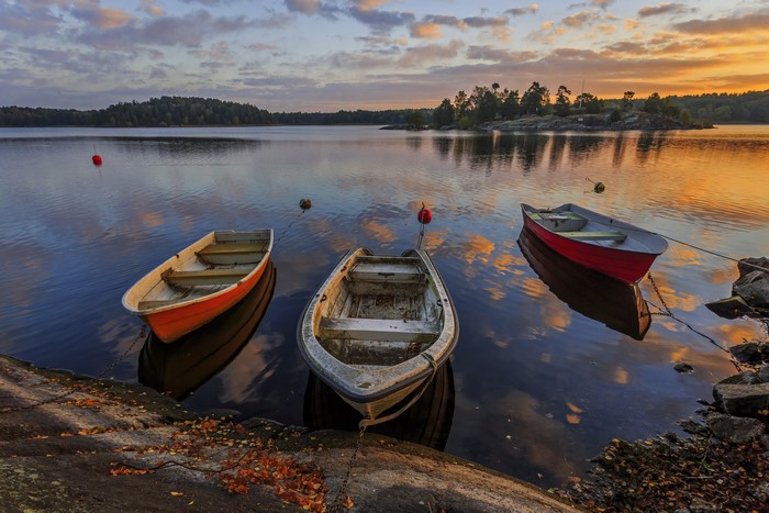 Boats on a lake at sunrise in Sweden