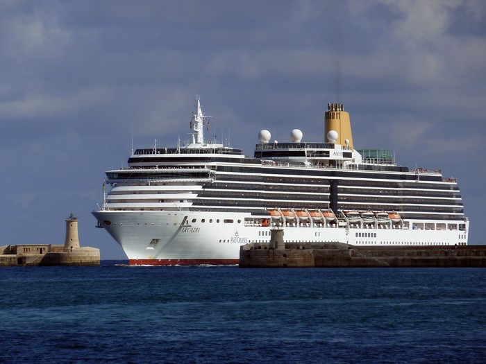Arcadia cruise liner sailing past lighthouses