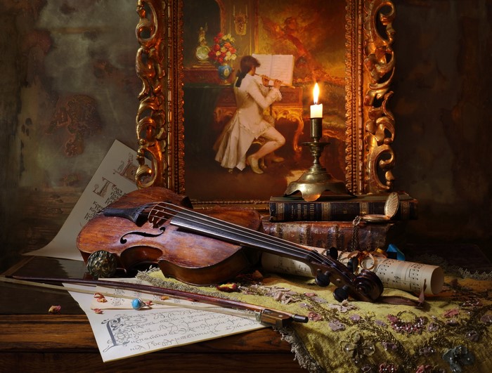 Still-life with violin, painting, and candle