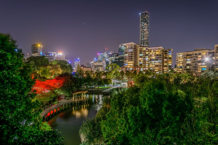 Brisbane skyline at night with a park and river